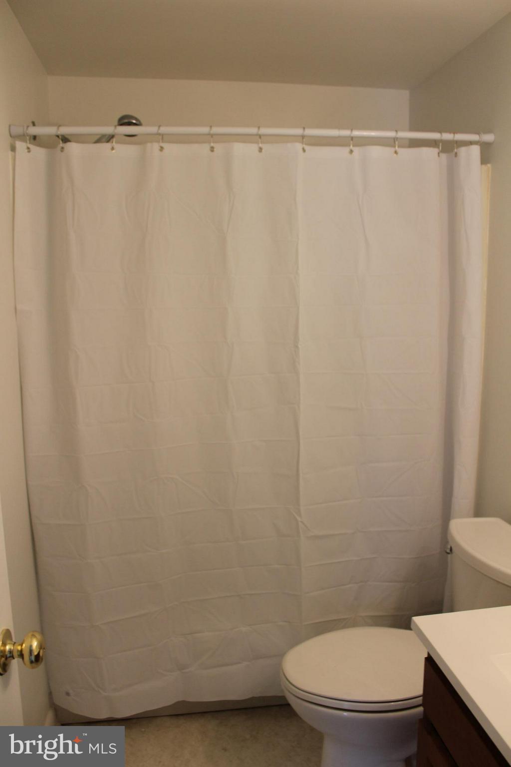 806 North Reymann Street Ranson, WV 25438 - Photo 18 of 25 a bathroom with a mirror