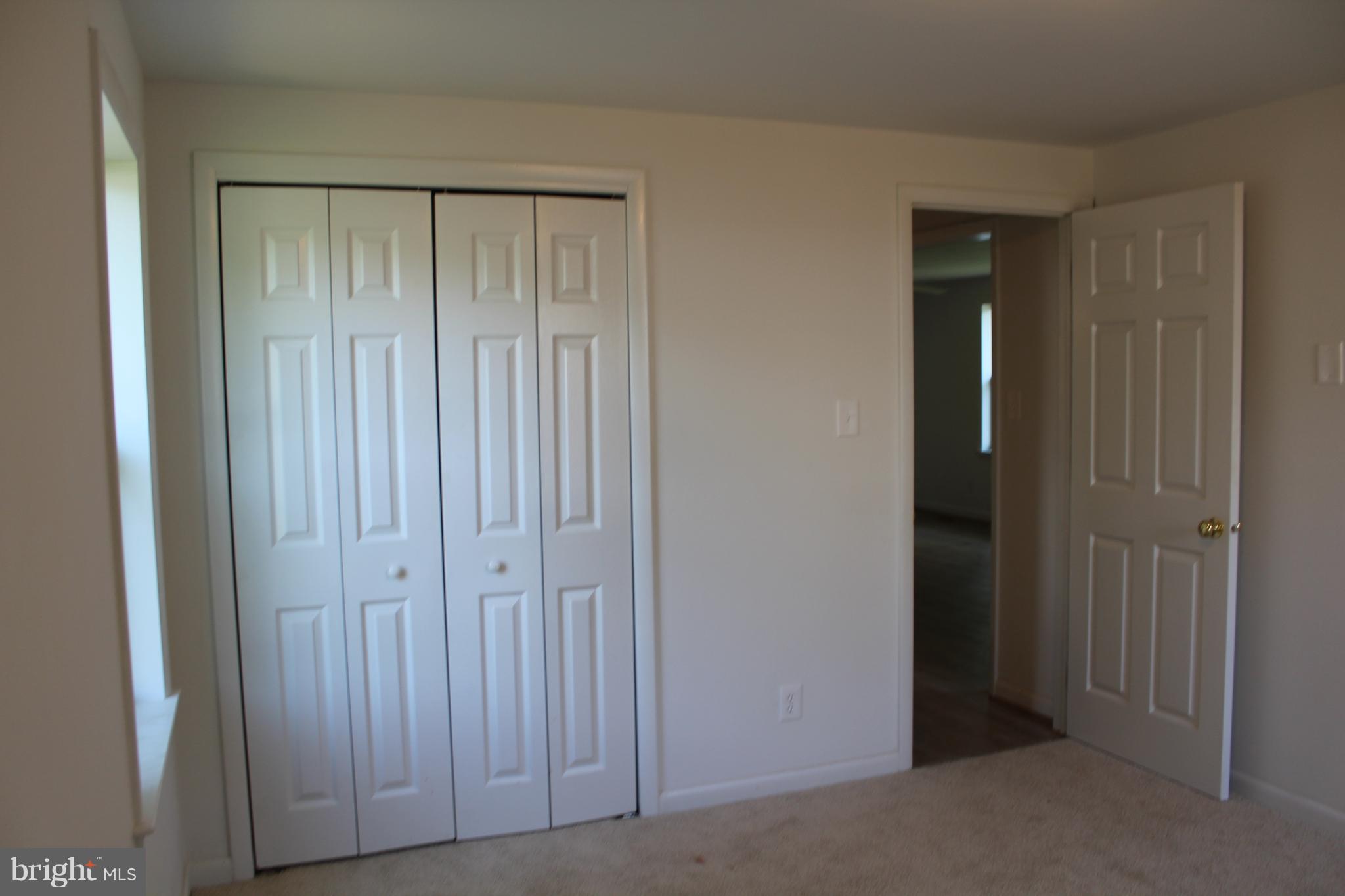 806 North Reymann Street Ranson, WV 25438 - Photo 19 of 25 a view of an empty room with wooden door