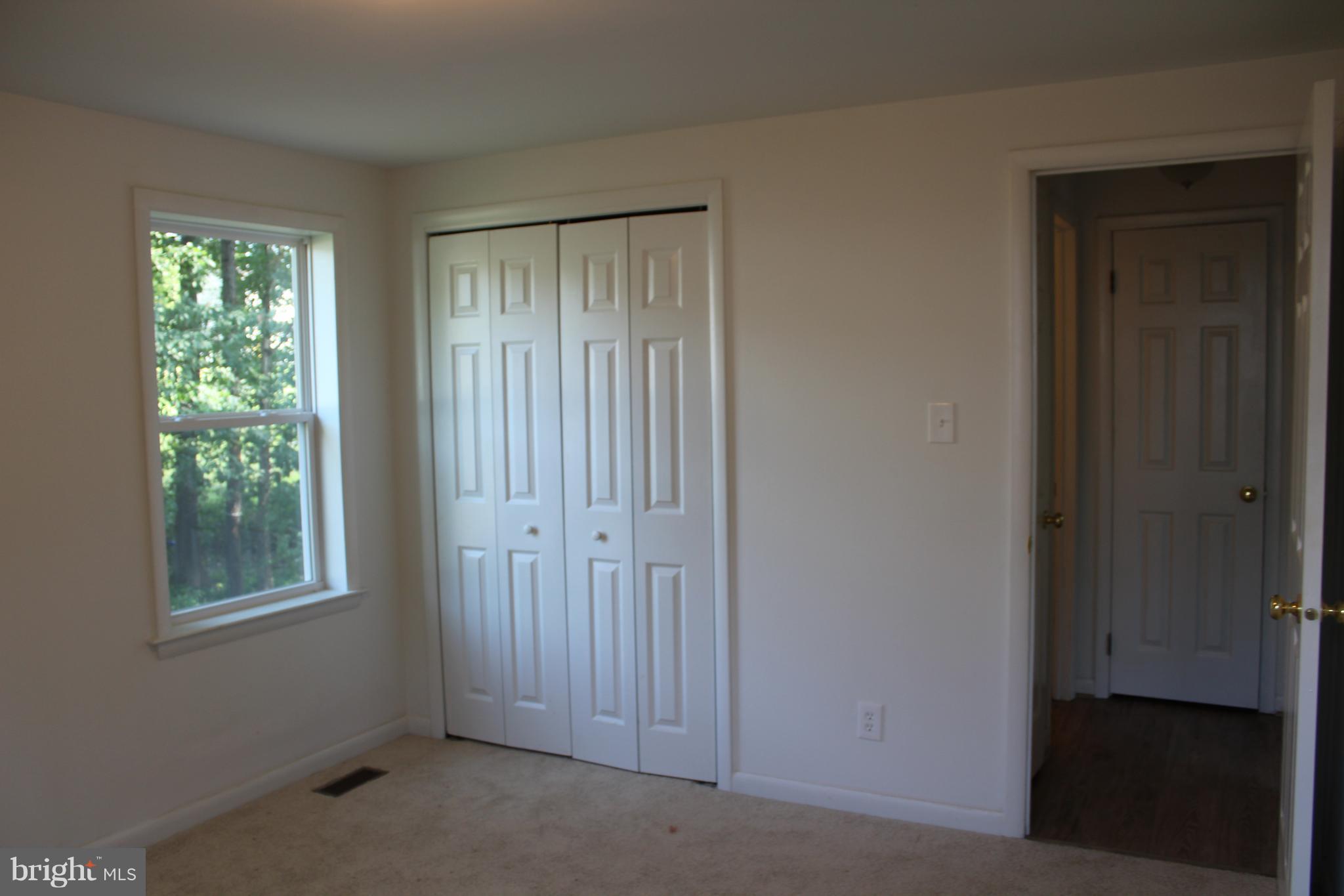 806 North Reymann Street Ranson, WV 25438 - Photo 20 of 25 a view of an empty room with windows and closet