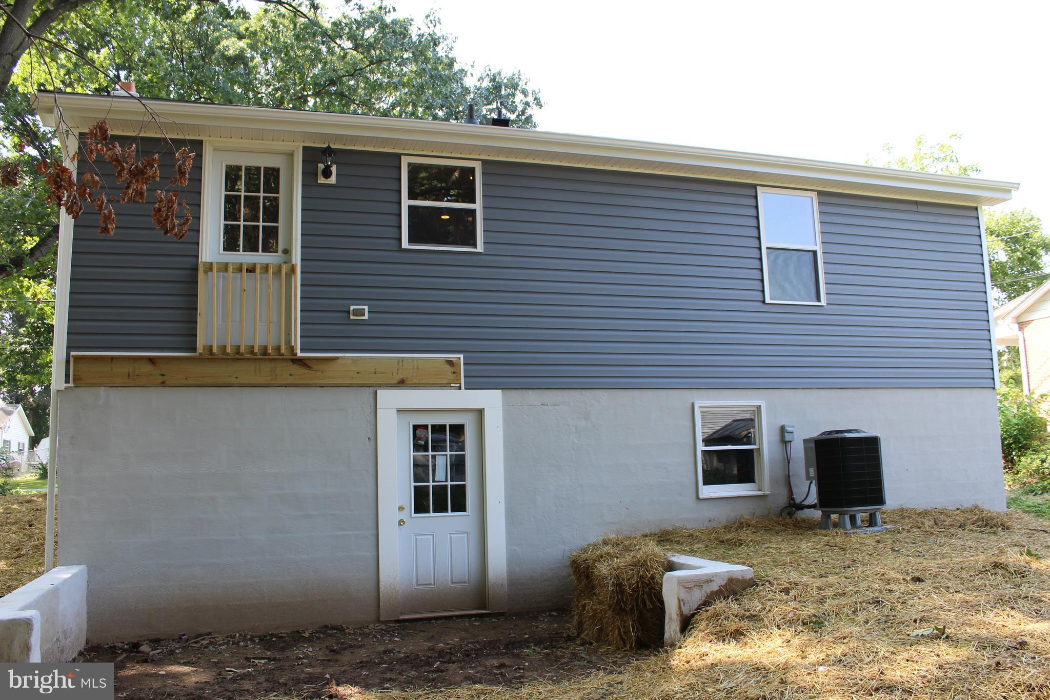 806 North Reymann Street Ranson, WV 25438 - Photo 25 of 25 a view of a house with a backyard