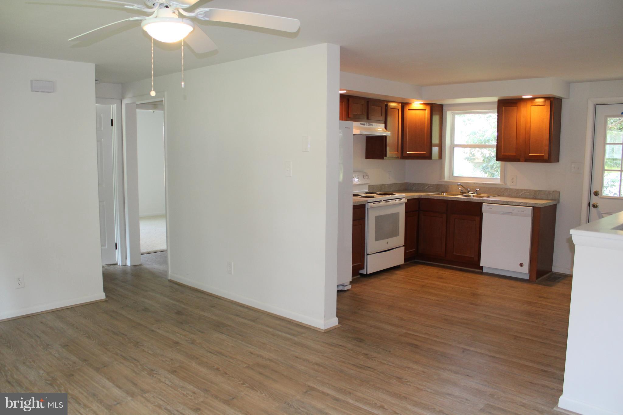 806 North Reymann Street Ranson, WV 25438 - Photo 10 of 25 a large kitchen with stainless steel appliances granite countertop a stove and a sink