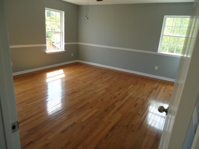 1076 Jacob's Valley Road Joelton, TN 37080 - Photo 14 of 20 a view of empty room with wooden floor and fan
