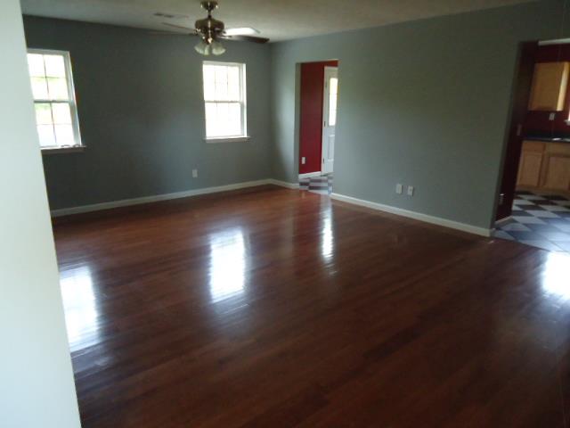 1076 Jacob's Valley Road Joelton, TN 37080 - Photo 10 of 20 an empty room with wooden floor and windows