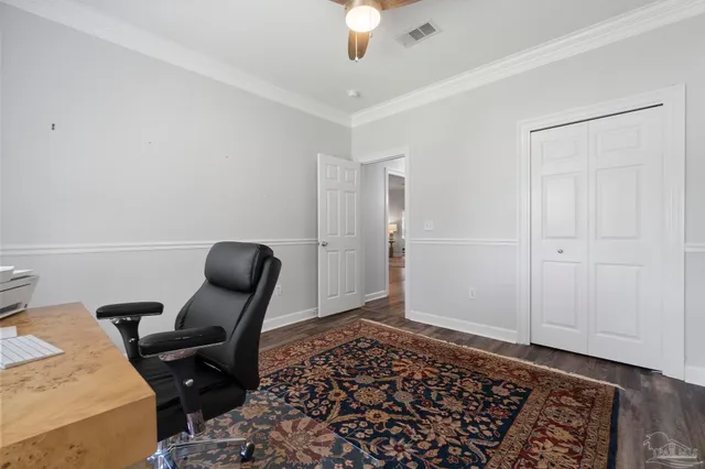 a workspace with furniture and wooden floor