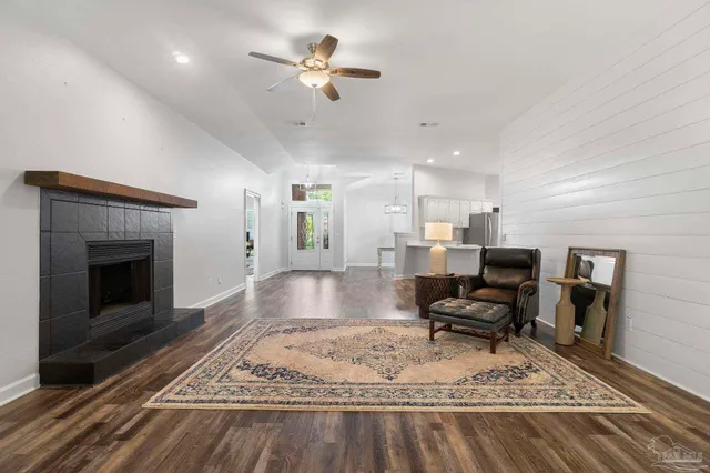 a living room with furniture and a fireplace