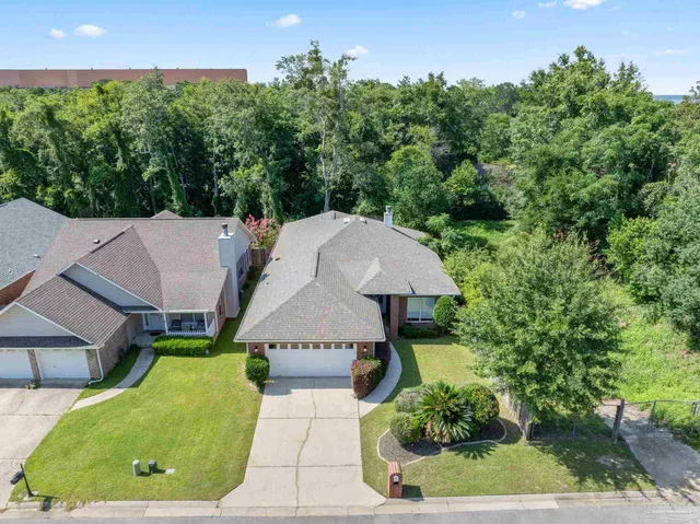 an aerial view of a house with a garden