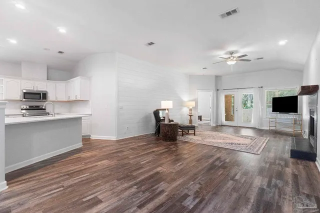 a view of a kitchen with microwave and cabinets