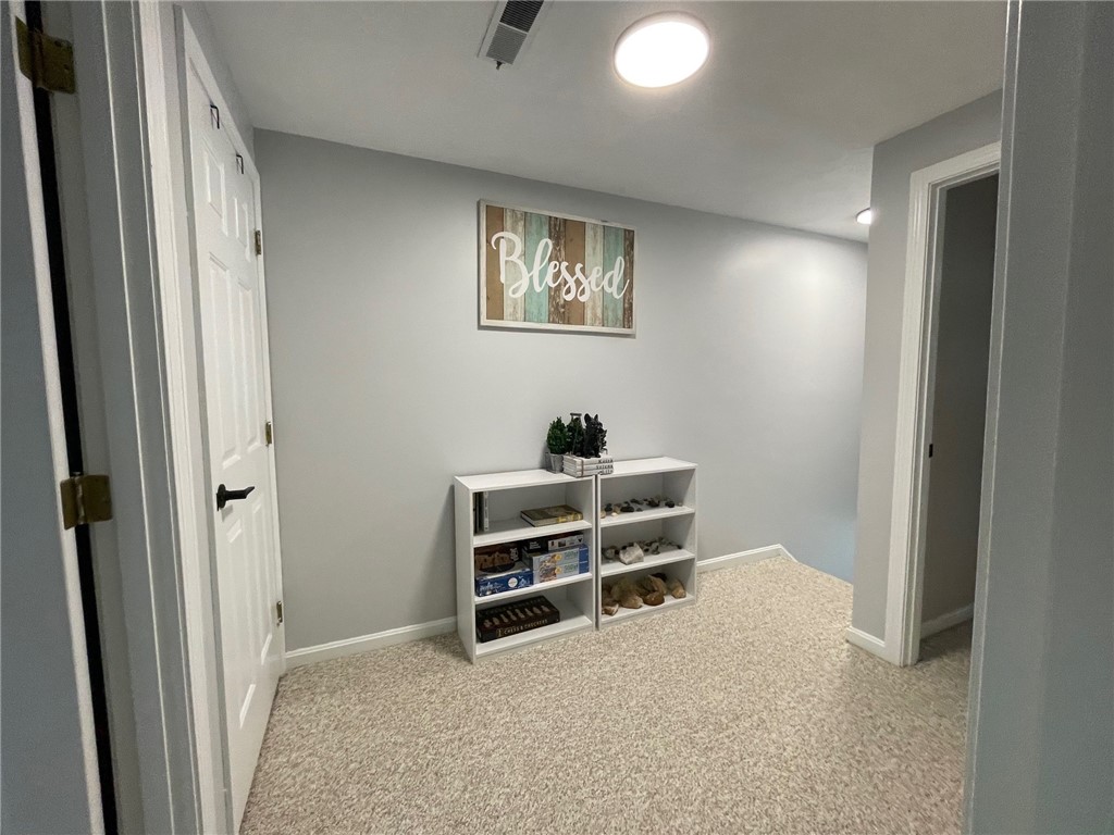 161 West Shore Road, Unit C7 Warwick, RI 02889 - Photo 22 of 36 This is a very large area at the top of the stairs to the second floor. To the left is a large closet. Both bedrooms and the full bath are off of this bonus area.
