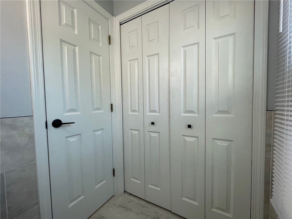 161 West Shore Road, Unit C7 Warwick, RI 02889 - Photo 35 of 36 Half bath has a lot of storage space.