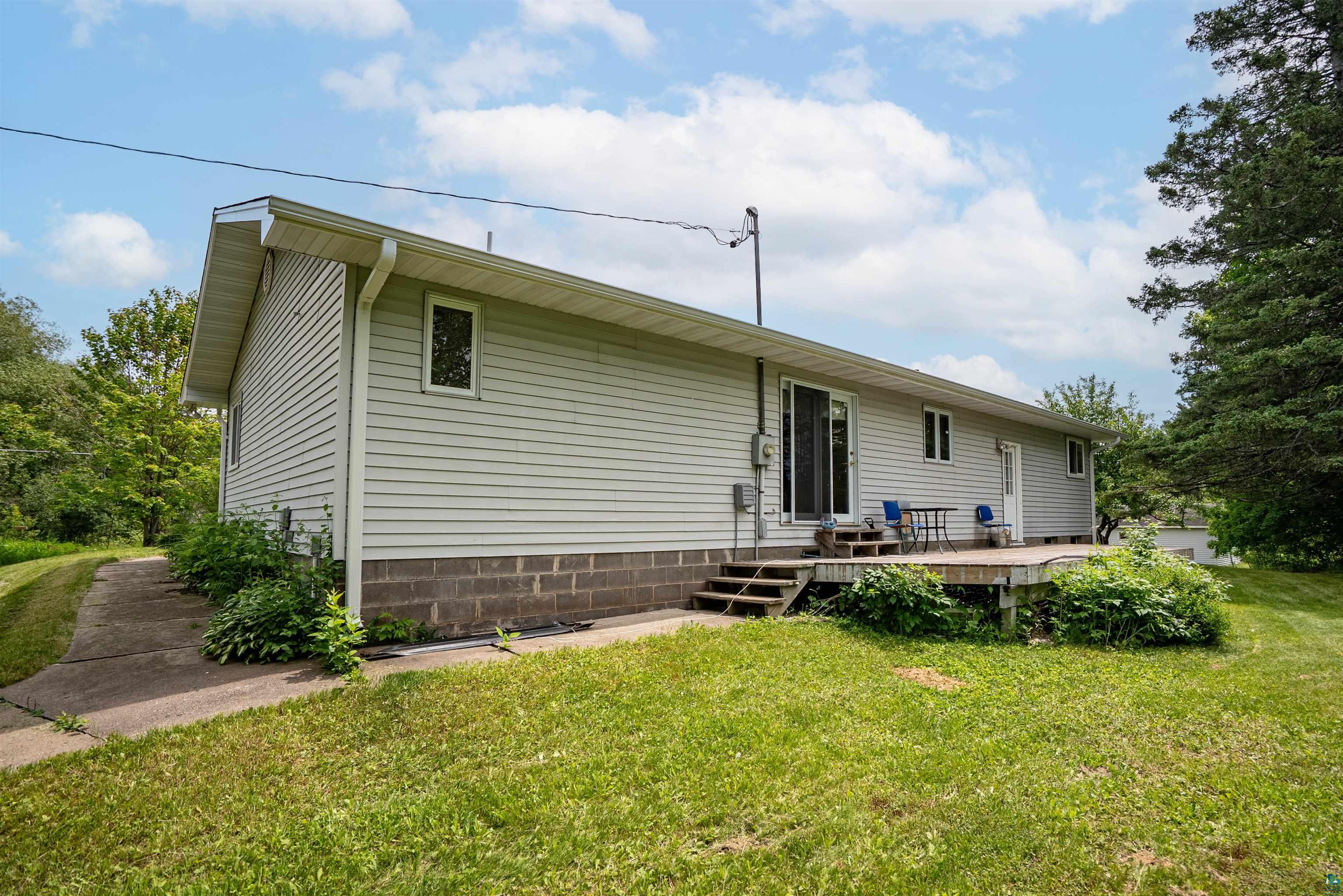 3711 Getchell Road Hermantown, MN 55811 - Photo 23 of 31 Exterior siding in a light neutral tone with a contrasting block foundation