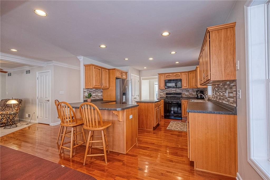 169 Howes Run Road Sarver, PA 16055 - Photo 13 of 48 GLISTENING HARDWOOD FLOORS GRACE THE KITCHEN