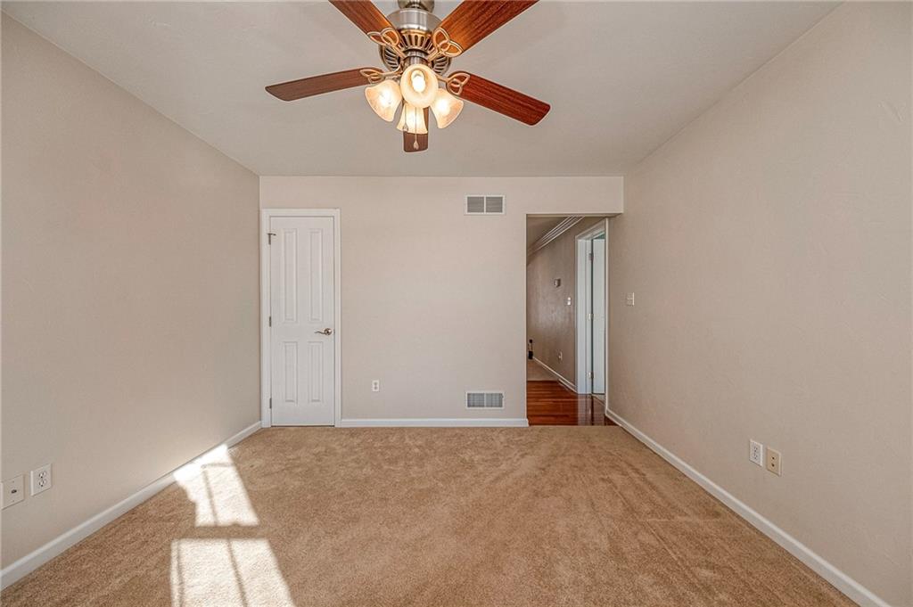 169 Howes Run Road Sarver, PA 16055 - Photo 20 of 48 Sitting room with glimpse into hallway leading to first floor primary and half bath.