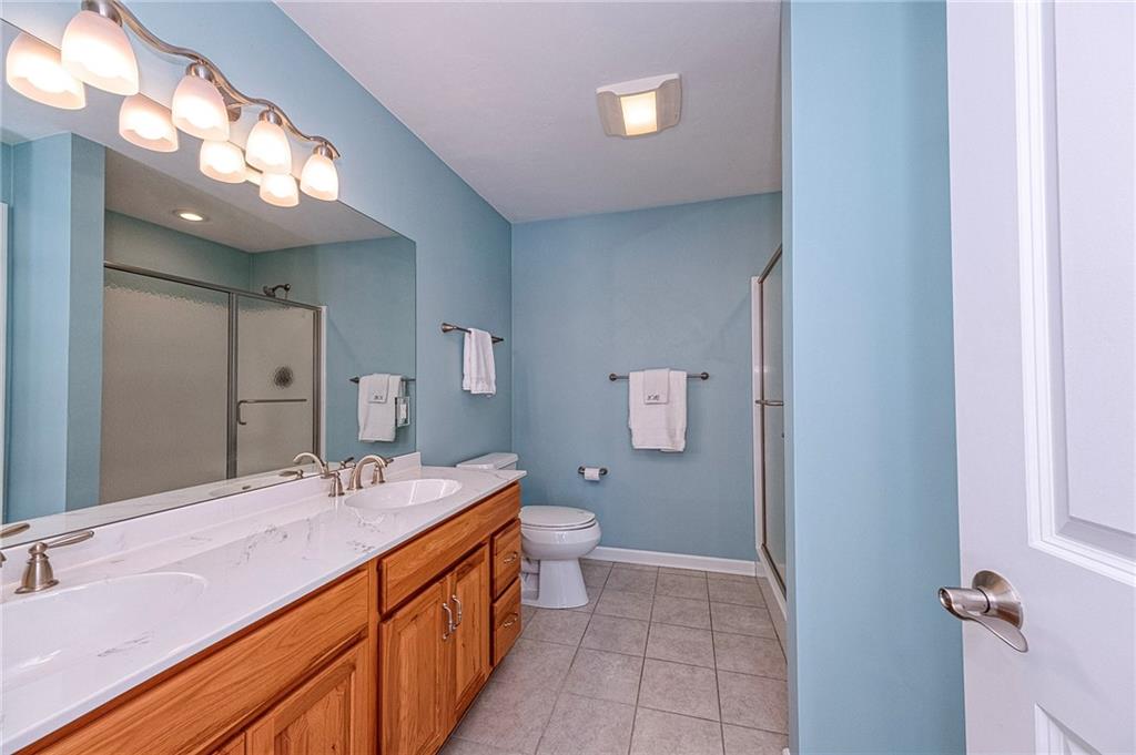 169 Howes Run Road Sarver, PA 16055 - Photo 23 of 48 Shower, double bowl sinks & ceramic tiled floor are found in the 1st floor en suite.