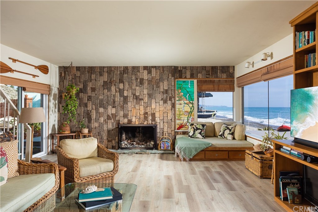 35811 Beach Road Dana Point, CA 92624 - Photo 12 of 41 a living room with furniture and a fireplace
