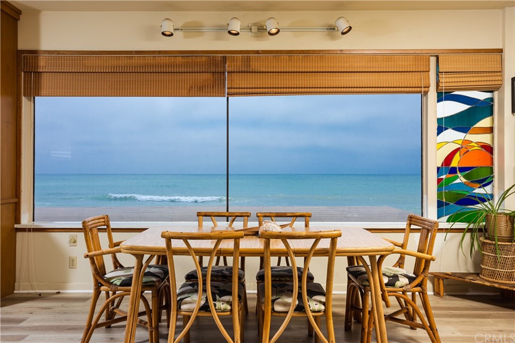 35811 Beach Road Dana Point, CA 92624 - Photo 14 of 41 a view of a patio with table and chairs and potted plants