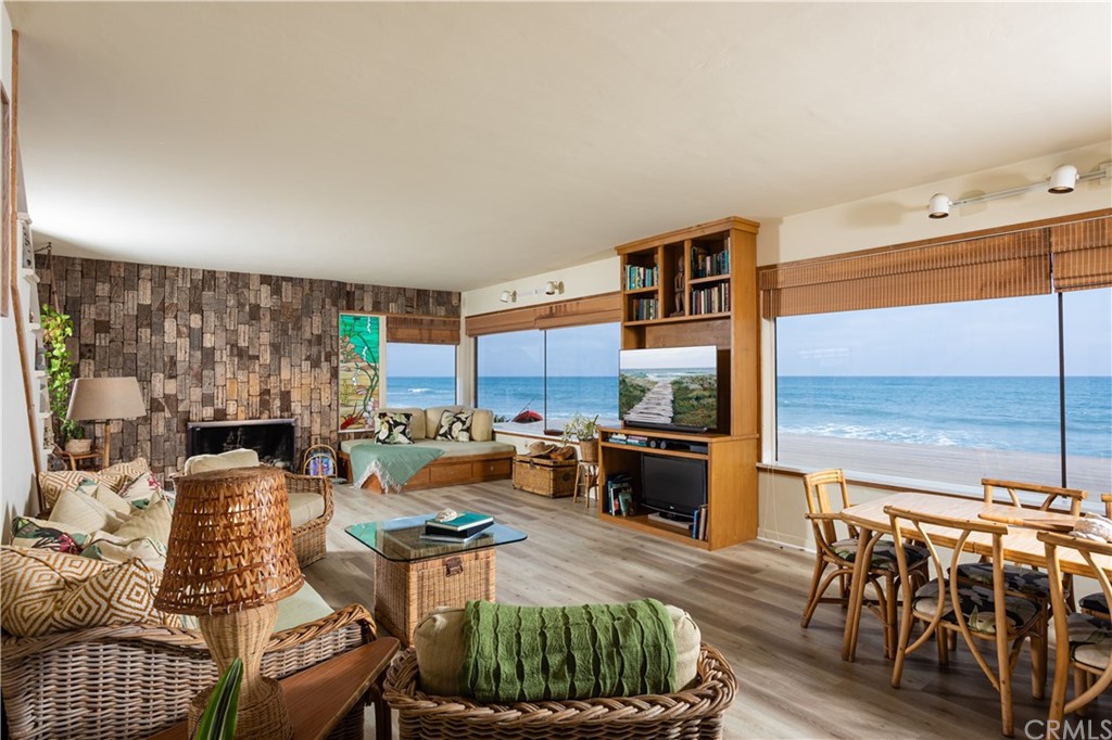 35811 Beach Road Dana Point, CA 92624 - Photo 17 of 41 a living room with furniture a fireplace and a flat screen tv