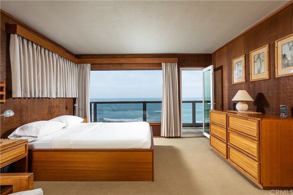35811 Beach Road Dana Point, CA 92624 - Photo 18 of 41 a bed room with a bed and a large window