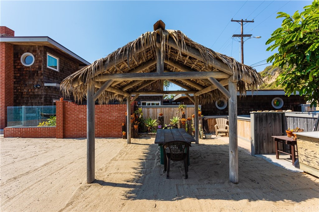 35811 Beach Road Dana Point, CA 92624 - Photo 28 of 41 a view of a chairs and table in patio