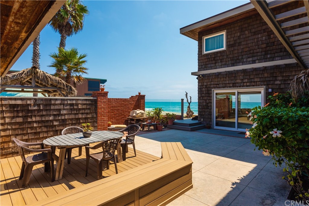 35811 Beach Road Dana Point, CA 92624 - Photo 9 of 41 a view of a patio with table and chairs and potted plants