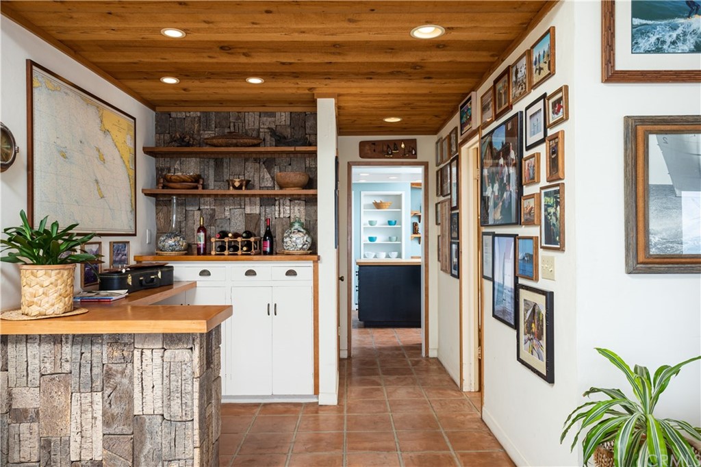 35811 Beach Road Dana Point, CA 92624 - Photo 10 of 41 a kitchen with stainless steel appliances kitchen island granite countertop a refrigerator and a counter top space