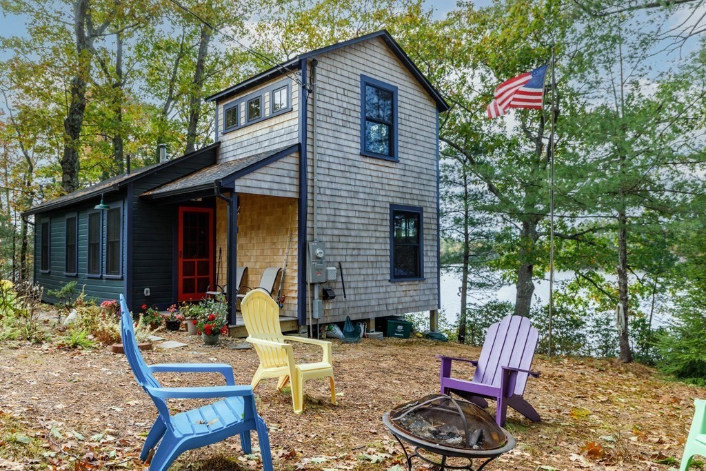 213 Ashby Road Ashburnham, MA 01430 - Photo 1 of 28 a view of a house with backyard sitting area and garden