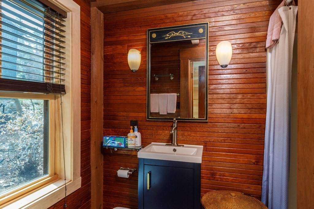 213 Ashby Road Ashburnham, MA 01430 - Photo 11 of 28 a bathroom with a sink and a mirror