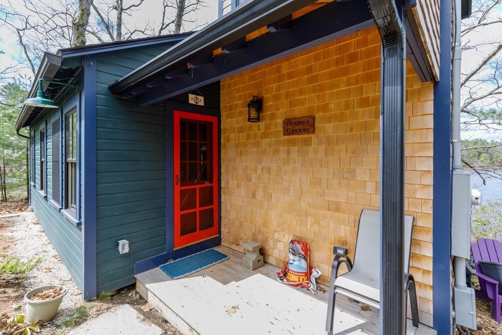 213 Ashby Road Ashburnham, MA 01430 - Photo 16 of 28 a view of a door and chair in the balcony
