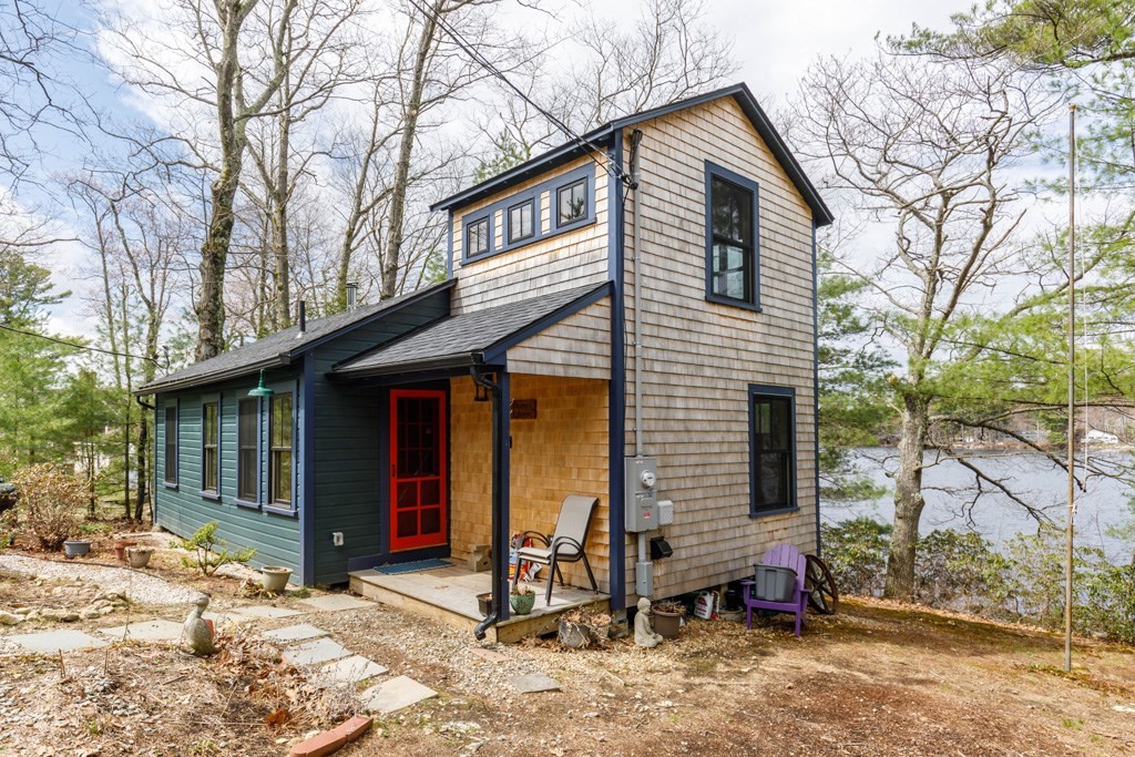 213 Ashby Road Ashburnham, MA 01430 - Photo 22 of 28 a front view of a house with yard and seating space