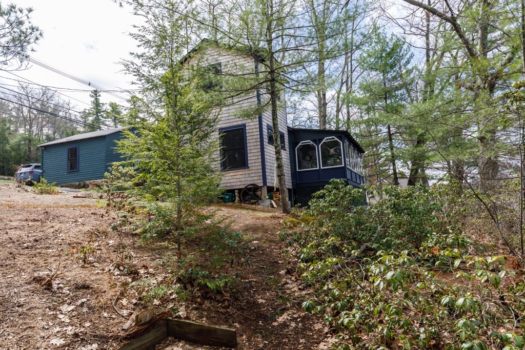 213 Ashby Road Ashburnham, MA 01430 - Photo 25 of 28 a view of a house with a yard and large trees