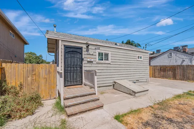 a view of backyard with a small cabin