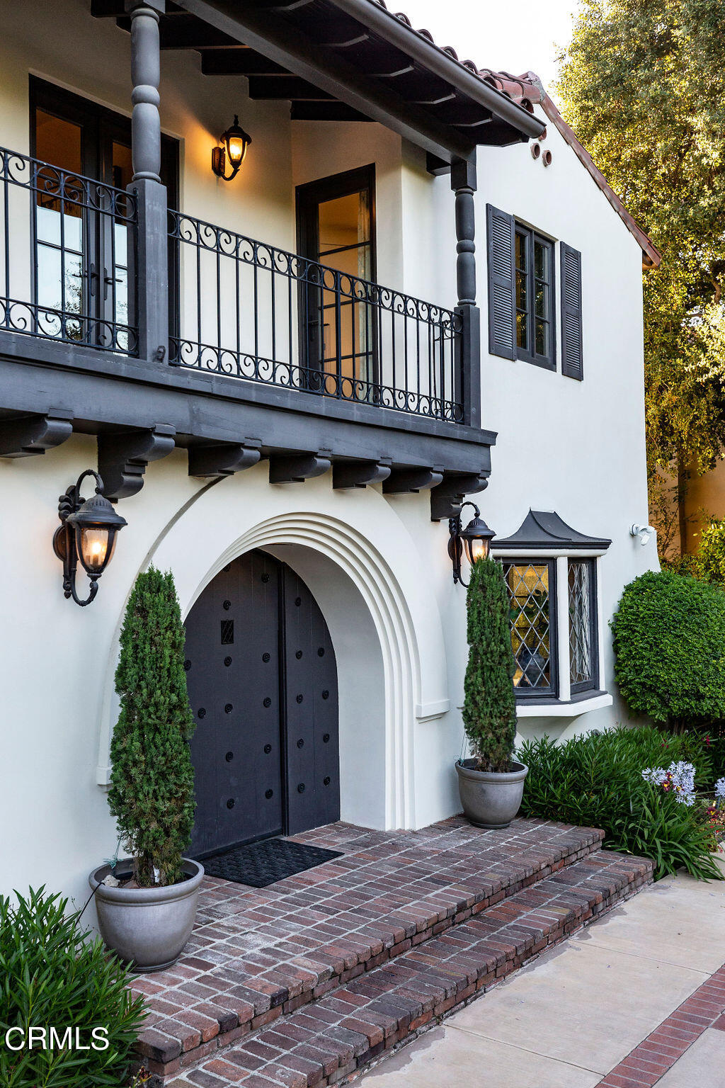 1589 Oak Grove Avenue San Marino, CA 91108 - Photo 2 of 2 a front view of a house with garden