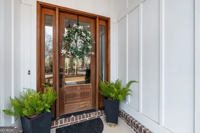 a living room with furniture fireplace and a large window