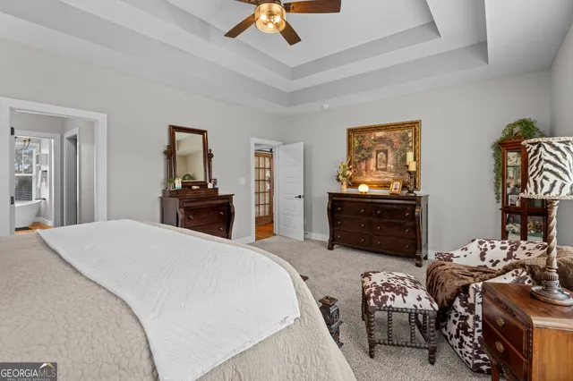 a white bath tub sitting in front of a bathroom