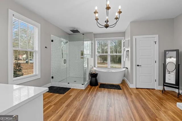a kitchen with stainless steel appliances granite countertop sink stove and refrigerator