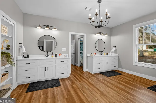 a view of a workspace with furniture window and wooden floor