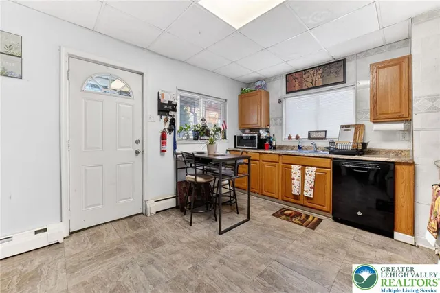 a kitchen with a sink cabinets and window