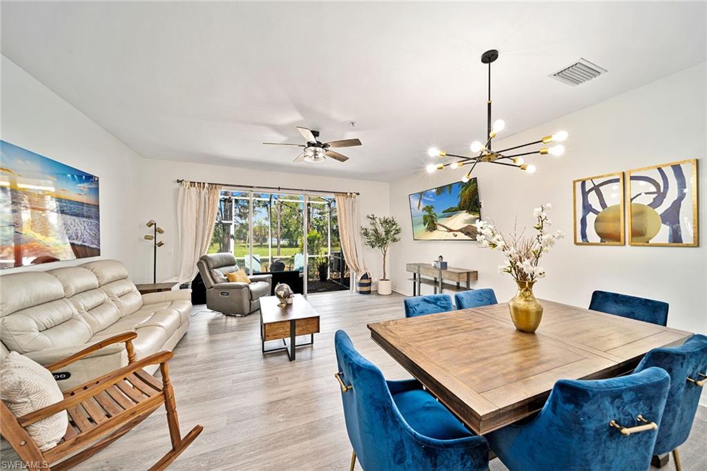 816 Hampton Circle Naples, FL 34105 - Photo 12 of 49 a living room with furniture and wooden floor