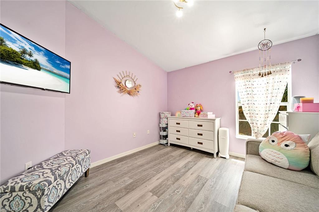 816 Hampton Circle Naples, FL 34105 - Photo 21 of 49 a bed room with a bed and a window