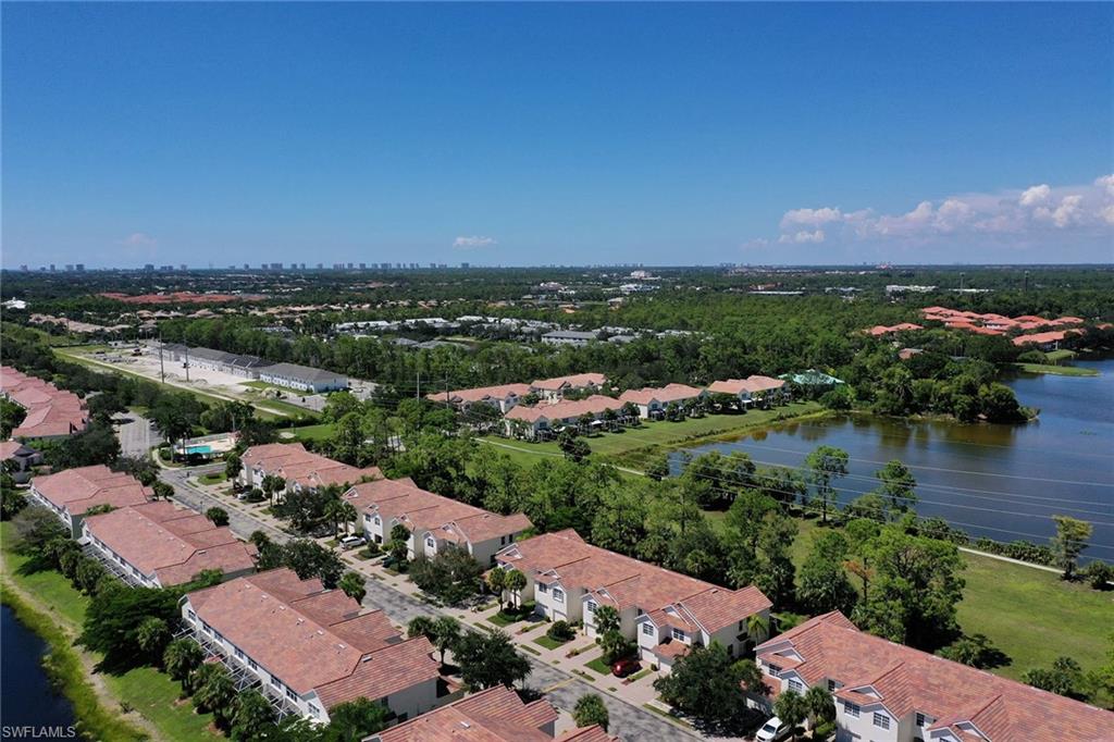 816 Hampton Circle Naples, FL 34105 - Photo 37 of 49 an aerial view of a houses with a lake view