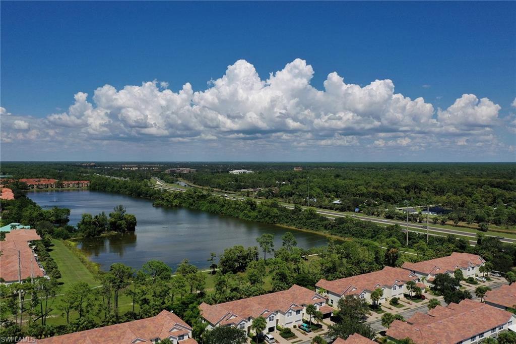 816 Hampton Circle Naples, FL 34105 - Photo 38 of 49 an aerial view of a house with a lake view