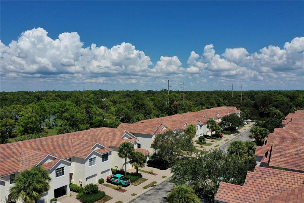 816 Hampton Circle Naples, FL 34105 - Photo 42 of 49 an aerial view of a house with a garden