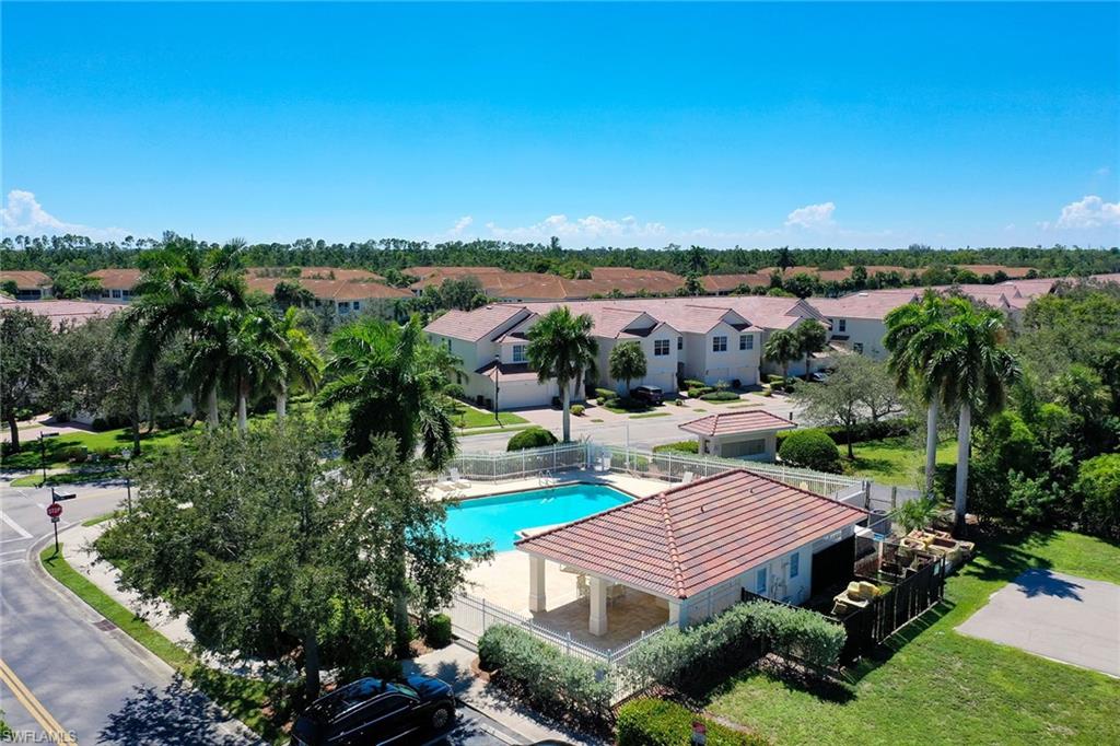 816 Hampton Circle Naples, FL 34105 - Photo 47 of 49 a view of a patio with furniture and a garden