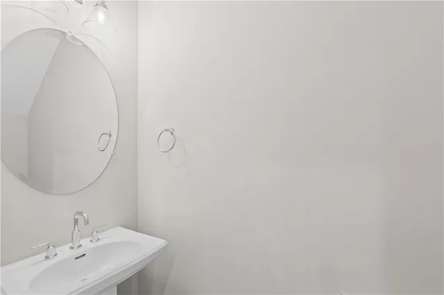 a bathroom with a sink and mirror