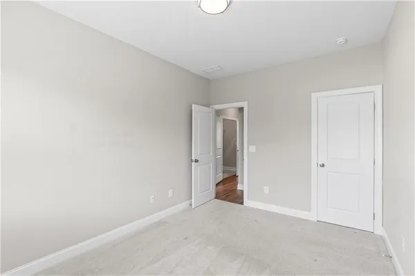 a view of an empty room and entryway