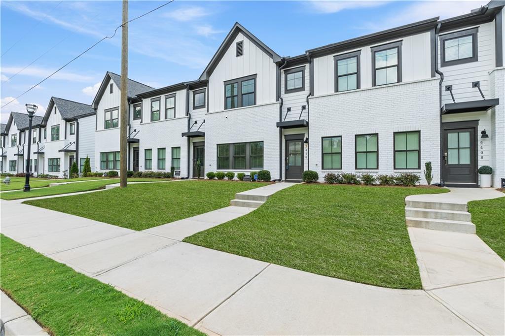 2410 Lakeshore Lane Atlanta, GA 30316 - Photo 2 of 31 a front view of a house with a yard