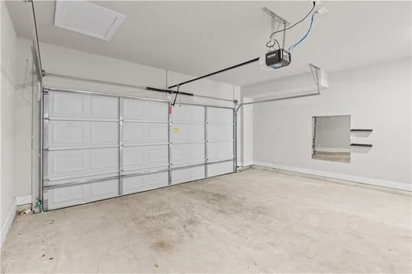 a view of a utility room with closet and windows