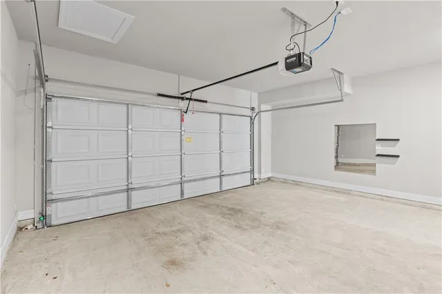 a view of a utility room with closet and windows