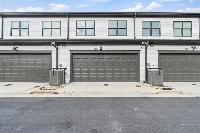 a front view of a house with a garage