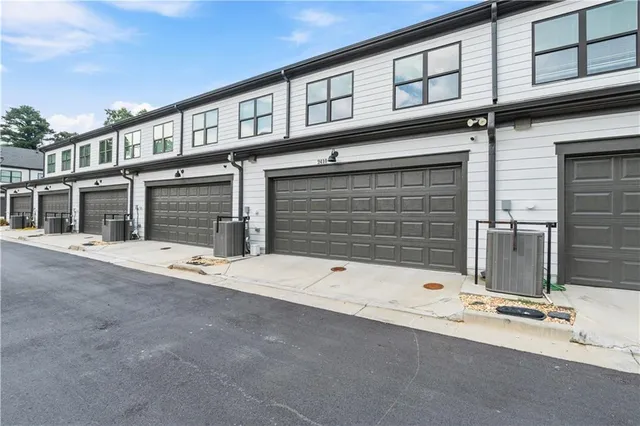 a front view of a house with white walls