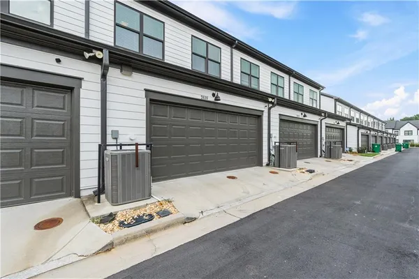 a view of a street with a building in the background